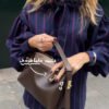 قميص نسائي مريح مخطط بألوان متباينة