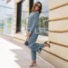 4763f4ae-a83a-437a-bb9a-efbc4aab8998.jpg طقم نسائي محبوك مكون من قطعتين، بأكمام طويلة وجزء علوي فضفاض وبنطال واسع الساق