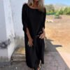 بدلة طويلة فضفاضة غير منتظمة بتصميم أزرار معدنية ورقبة دائرية وقميص بأكمام طويلة وبنطلون مستقيم وبنطلون واسع الساق من ملابس النساء