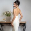 686584df-75eb-4555-aba3-30daca2556a7.jpg فستان ساتان بلون سادة مثير بدون ظهر وحمالات رفيعة