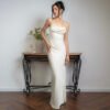 cbcf31a7-91af-40c7-b95b-a0d27ed5ea69.jpg فستان ساتان بلون سادة مثير بدون ظهر وحمالات رفيعة
