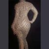 e0a8d250-95f6-40c4-abba-7fd3242bb2e4.jpg فستان طويل ضيق شفاف مجوف مزين بكريستالات ملونة