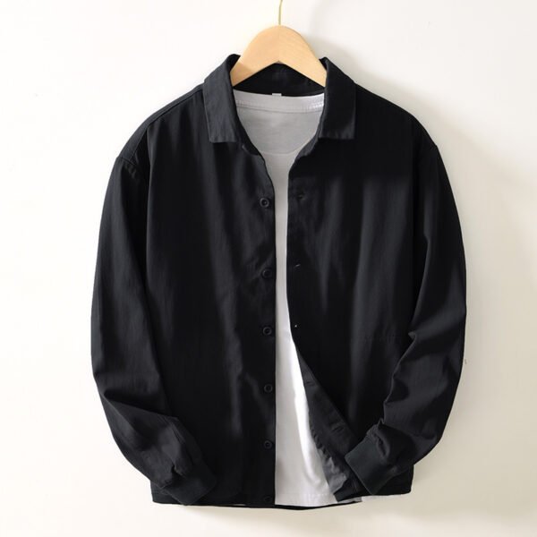 2f23d145-3806-487e-94f5-4defb6eb1b9d.jpg زي بيسبول فضفاض بتصميم جيب كلاسيكي