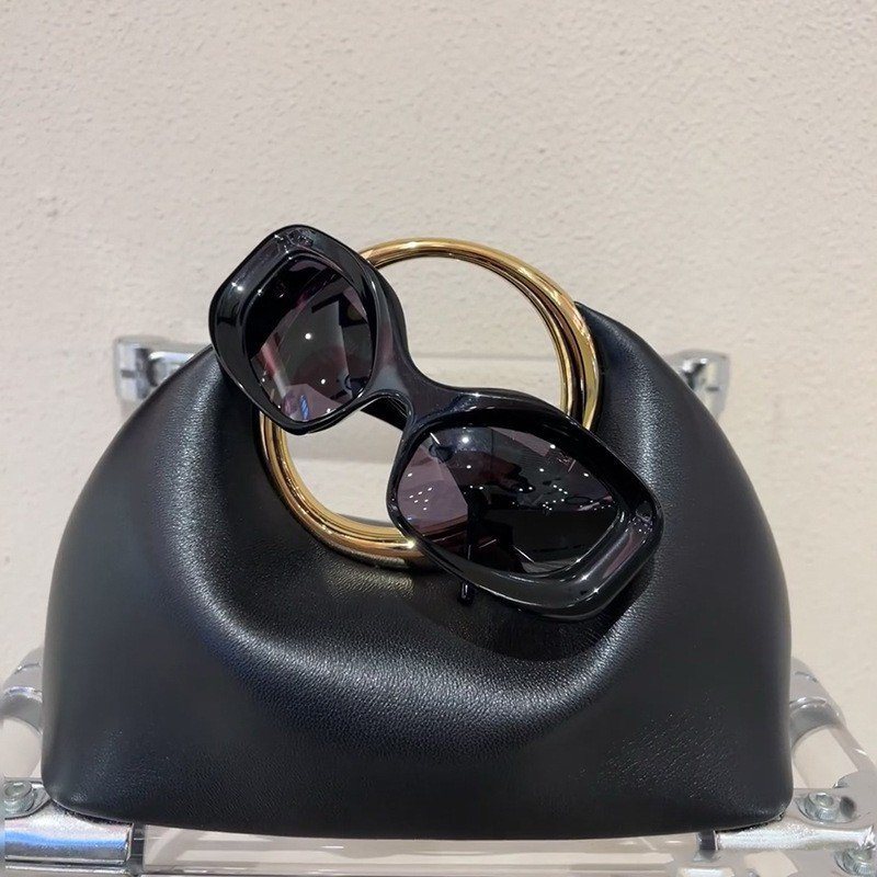 حقيبة جلدية ناعمة بسيطة مع حلقة حمل يدوية