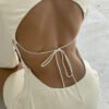 9c70353c-f495-4675-96da-48888edc8d79.jpg فستان ساتان مجوف بدون ظهر ورباط