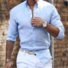 قميص من القطن والكتان بأكمام طويلة وياقة بولو بلون سادة ونمط كاجوال