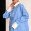 94128a9e-143f-4026-939a-5a4425a7d3c6.jpg بلوزة نسائية كاجوال باللونين الأزرق والأبيض