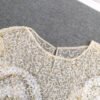 c9895b1d-c116-4842-be68-1c98baf07a48.jpg بلوزة أنيقة مزينة بالترتر والخرز للنساء