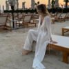 91461c1d-0689-49d9-9ba0-894266f0ed03-1.jpg طقم مكون من قطعتين: بلوزة شفافة برباط أمامي وخصر محدد، وبنطال