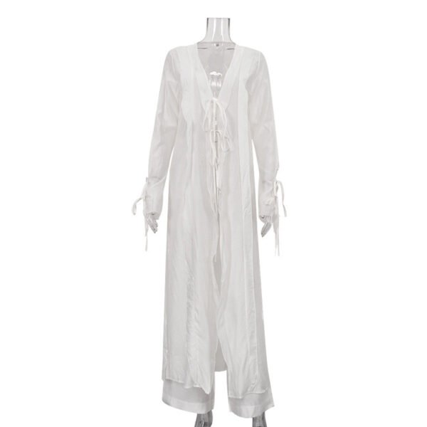 a32ed8ea-1af3-4608-b895-7a9709fd70da-4.jpg طقم مكون من قطعتين: بلوزة شفافة برباط أمامي وخصر محدد، وبنطال