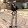 e3e6526a-fa5c-4a00-b1b8-3724b60f8a8e.jpg بنطلون نسائي مستقيم بخصر مرتفع ومزين بالترتر من Heavy Industry